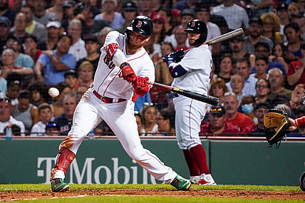 Aug 26, 2021; Boston, Massachusetts, USA; Boston Red Sox left fielder Alex Verdugo (99) drives in a run with a single against the Minnesota Twins in the third inning at Fenway Park. Mandatory Credit: David Butler II-USA TODAY Sports