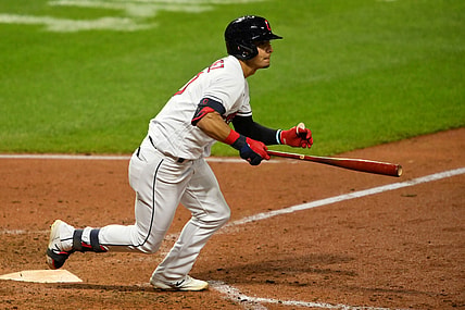 Aug 26, 2021; Cleveland, Ohio, USA; Cleveland Indians second baseman Andres Gimenez (0) hits an RBI double against the Texas Rangers in the fourth inning at Progressive Field. Mandatory Credit: David Richard-USA TODAY Sports