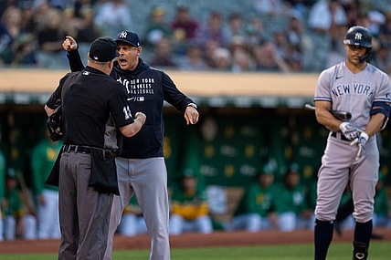 Aug 26, 2021; Oakland, California, USA;  New York Yankees manager Aaron Boone (17) argues with umpire Todd Tichenor (13) after being ejected from the game against the Oakland Athletics during the second inning at RingCentral Coliseum. Mandatory Credit: Neville E. Guard-USA TODAY Sports