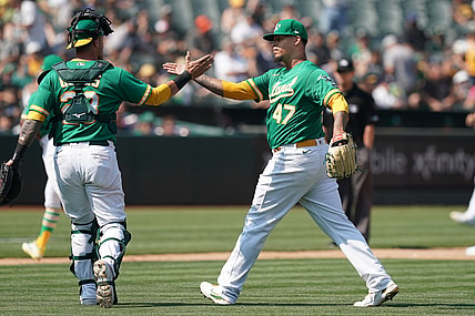 Aug 28, 2021; Oakland, California, USA; Oakland Athletics starting pitcher Frankie Montas (47) celebrates with catcher Yan Gomes (23) during the seventh inning against the New York Yankees at RingCentral Coliseum. Mandatory Credit: Darren Yamashita-USA TODAY Sports