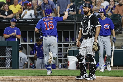 Aug 28, 2021; Chicago, Illinois, USA; Chicago Cubs third baseman Patrick Wisdom (16) celebrates as he crosses home plate after hitting a solo home run against the Chicago White Sox during the fifth inning at Guaranteed Rate Field. Mandatory Credit: Kamil Krzaczynski-USA TODAY Sports