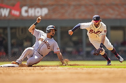 Aug 29, 2021; Cumberland, Georgia, USA; San Francisco Giants right fielder LaMonte Wade Jr. (31) steals second base ahead of a tag by Atlanta Braves shortstop Dansby Swanson (7) during the third inning at Truist Park. Mandatory Credit: Dale Zanine-USA TODAY Sports
