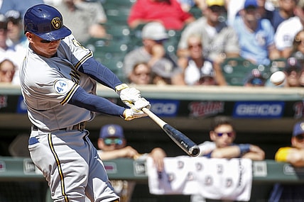 Aug 29, 2021; Minneapolis, Minnesota, USA; Milwaukee Brewers shortstop Luis Urias (2) hits a solo home run against the Minnesota Twins in the second inning at Target Field. Mandatory Credit: Bruce Kluckhohn-USA TODAY Sports