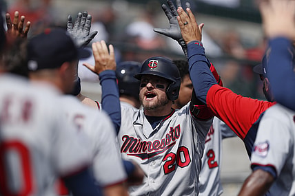 Aug 30, 2021; Detroit, Michigan, USA; Minnesota Twins designated hitter Josh Donaldson (20) is congratulated in the dugout after hitting a two-run home run during the fourth inning against the Detroit Tigers at Comerica Park. Mandatory Credit: Raj Mehta-USA TODAY Sports