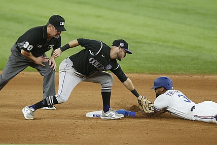 Aug 31, 2021; Arlington, Texas, USA; Texas Rangers center fielder Leody Taveras (3) steals second base against Colorado Rockies second baseman Garrett Hampson (1) in the sixth inning at Globe Life Field. Mandatory Credit: Tim Heitman-USA TODAY Sports