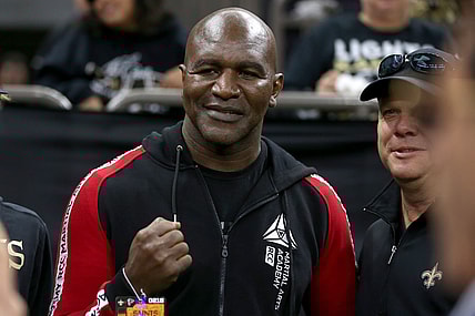 Nov 10, 2019; New Orleans, LA, USA; Former heavyweight boxing champion Evander Holyfield poses for pictures before a game between the New Orleans Saints and the Atlanta Falcons at the Mercedes-Benz Superdome. Mandatory Credit: Chuck Cook-USA TODAY Sports