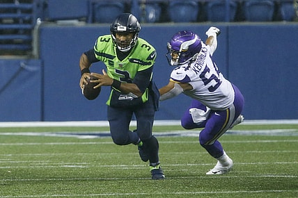 Oct 11, 2020; Seattle, Washington, USA; Seattle Seahawks quarterback Russell Wilson (3) escapes from Minnesota Vikings middle linebacker Eric Kendricks (54) during the fourth quarter at CenturyLink Field. Mandatory Credit: Joe Nicholson-USA TODAY Sports