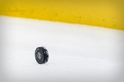 Apr 20, 2021; Dallas, Texas, USA; A view of a hockey puck and yellow boards before the game between the Dallas Stars and the Detroit Red Wings at the American Airlines Center. Mandatory Credit: Jerome Miron-USA TODAY Sports