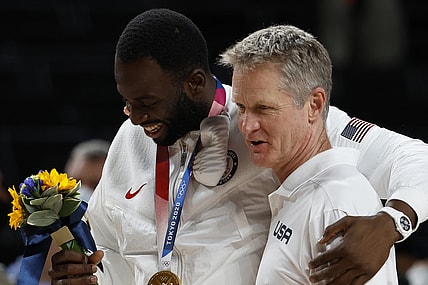 Aug 7, 2021; Saitama, Japan; United States forward Draymond Green (L) hugs assistant coach Steve Kerr (R) after the medal ceremony during the Tokyo 2020 Olympic Summer Games at Saitama Super Arena. Mandatory Credit: Geoff Burke-USA TODAY Sports