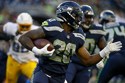 Aug 28, 2021; Seattle, Washington, USA; Seattle Seahawks running back Rashaad Penny (20) rushes against the Los Angeles Chargers during the first quarter at Lumen Field. Mandatory Credit: Joe Nicholson-USA TODAY Sports