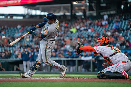 Sep 3, 2021; San Francisco, California, USA;  Milwaukee Brewers catcher Omar Narvaez (10) hits a RBI single against the San Francisco Giants during the first inning at Oracle Park. Mandatory Credit: Neville E. Guard-USA TODAY Sports