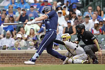 Sep 3, 2021; Chicago, Illinois, USA; Chicago Cubs first baseman Frank Schwindel (18) hits an RBI-single against the Pittsburgh Pirates during the second inning at Wrigley Field. Mandatory Credit: Kamil Krzaczynski-USA TODAY Sports