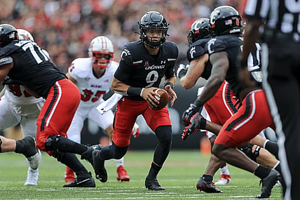 Sep 4, 2021; Cincinnati, Ohio, USA; Cincinnati Bearcats quarterback Desmond Ridder (9) tosses the ball against the Miami (Oh) Redhawks in the first half at Nippert Stadium. Mandatory Credit: Aaron Doster-USA TODAY Sports