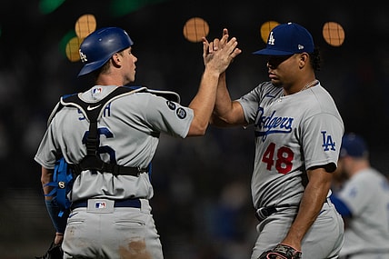 Sep 4, 2021; San Francisco, California, USA;  Los Angeles Dodgers catcher Will Smith (16) and relief pitcher Brusdar Graterol (48) celebrate after defeating the San Francisco Giants at Oracle Park. Mandatory Credit: Stan Szeto-USA TODAY Sports