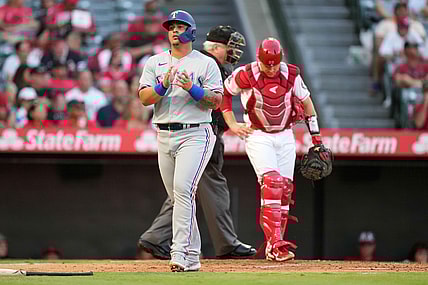 Sep 6, 2021; Anaheim, California, USA; Texas Rangers designated hitter Yohel Pozo (37) reacts after scoring against the Los Angeles Angels in the second inning at Angel Stadium. Mandatory Credit: Kirby Lee-USA TODAY Sports
