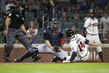 Sep 7, 2021; Atlanta, Georgia, USA; Washington Nationals catcher Riley Adams (25) tags out Atlanta Braves left fielder Adam Duvall (14) at the plate in the third inning at Truist Park. Mandatory Credit: Brett Davis-USA TODAY Sports