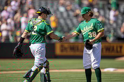 Sep 9, 2021; Oakland, California, USA;  Oakland Athletics relief pitcher Andrew Chafin (39) and Oakland Athletics catcher Sean Murphy (12) celebrate after the end of the game against the Chicago White Sox at RingCentral Coliseum. Mandatory Credit: Neville E. Guard-USA TODAY Sports