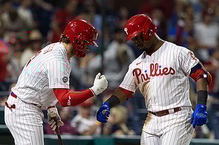 Sep 11, 2021; Philadelphia, Pennsylvania, USA; Philadelphia Phillies shortstop Jean Segura (2) celebrates with right fielder Bryce Harper (left) after hitting a home run against the Colorado Rockies during the fifth inning at Citizens Bank Park. Mandatory Credit: Bill Streicher-USA TODAY Sports