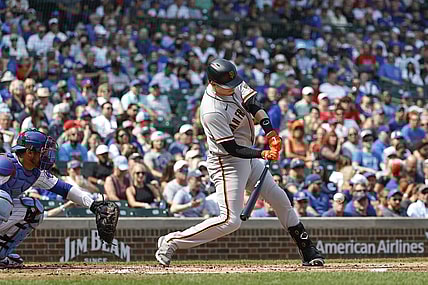 Sep 12, 2021; Chicago, Illinois, USA; San Francisco Giants second baseman Wilmer Flores (41) hits an RBI-single against the Chicago Cubs during the second inning at Wrigley Field. Mandatory Credit: Kamil Krzaczynski-USA TODAY Sports