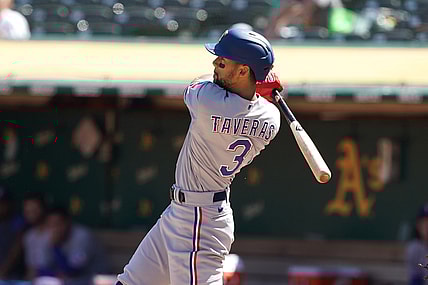 Sep 12, 2021; Oakland, California, USA; Texas Rangers center fielder Leody Taveras (3) hits an RBI triple during the fourth inning against the Oakland Athletics at RingCentral Coliseum. Mandatory Credit: Darren Yamashita-USA TODAY Sports