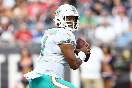 Sep 12, 2021; Foxborough, Massachusetts, USA; Miami Dolphins quarterback Tua Tagovailoa (1) looks to pass against the New England Patriots during the first half at Gillette Stadium. Mandatory Credit: Brian Fluharty-USA TODAY Sports