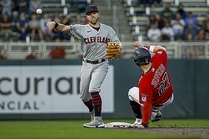 Sep 14, 2021; Minneapolis, Minnesota, USA; Cleveland Indians second baseman Owen Miller (6) forces out Minnesota Twins catcher Ryan Jeffers (27) and turns a double play in the second inning at Target Field. Mandatory Credit: Bruce Kluckhohn-USA TODAY Sports