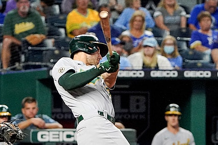 Sep 15, 2021; Kansas City, Missouri, USA; Oakland Athletics first baseman Matt Olson (28) hits a two run home run against the Kansas City Royals in the fourth inning at Kauffman Stadium. Mandatory Credit: Denny Medley-USA TODAY Sports