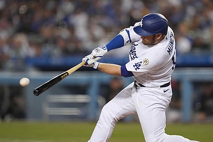 Sep 15, 2021; Los Angeles, California, USA; Los Angeles Dodgers first baseman Max Muncy (13) follows through on a single in the third inning against the Arizona Diamondbacks at Dodger Stadium. Mandatory Credit: Kirby Lee-USA TODAY Sports