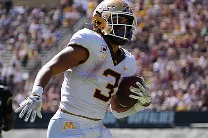 Sep 18, 2021; Boulder, Colorado, USA; Minnesota Golden Gophers running back Treyson Potts (3) carries for a touchdown in the first quarter at Folsom Field. Mandatory Credit: Ron Chenoy-USA TODAY Sports