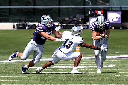 Sep 18, 2021; Manhattan, Kansas, USA; Nevada Wolf Pack defensive back Jordan Lee (13) tries to break away from the block by Kansas State Wildcats tight end Nick Lenners (87) to tackle Wildcats quarterback Will Howard (15) during the first quarter of a game at Bill Snyder Family Football Stadium. Mandatory Credit: Scott Sewell-USA TODAY Sports
