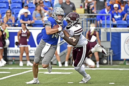 Sep 18, 2021; Memphis, Tennessee, USA; Memphis Tigers quarterback Seth Henigan (14) is pressured by Mississippi State Bulldogs defensive end Randy Charlton (5) during the first half at Liberty Bowl Memorial Stadium. Mandatory Credit: Justin Ford-USA TODAY Sports