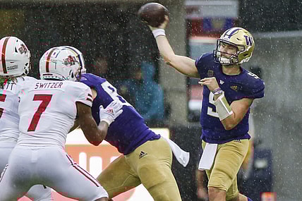 Sep 18, 2021; Seattle, Washington, USA; Washington Huskies quarterback Dylan Morris (9) throws a pass against the Arkansas State Red Wolves during the second quarter at Alaska Airlines Field at Husky Stadium. Mandatory Credit: Joe Nicholson-USA TODAY Sports