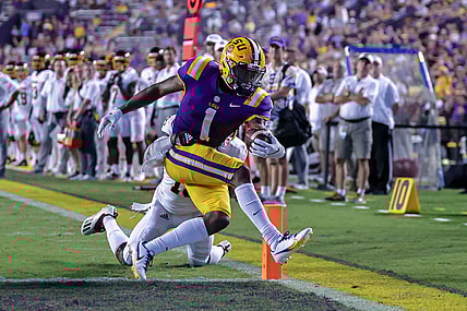 Sep 18, 2021; Baton Rouge, Louisiana, USA;  LSU Tigers wide receiver Kayshon Boutte (1) makes a 2 yard touchdown reception against Central Michigan Chippewas defensive back Donte Kent (19) during the first half at Tiger Stadium. Mandatory Credit: Stephen Lew-USA TODAY Sports