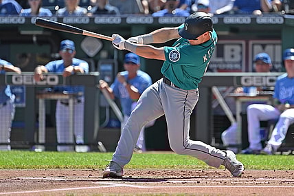 Sep 19, 2021; Kansas City, Missouri, USA;  Seattle Mariners center fielder Jarred Kelenic (10) hits a two run double during the first inning against the Kansas City Royals at Kauffman Stadium. Mandatory Credit: Peter Aiken-USA TODAY Sports