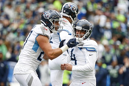 Sep 19, 2021; Seattle, Washington, USA; Tennessee Titans kicker Randy Bullock (14) celebrates with tight end Geoff Swaim (87) after kicking a game-winning field goal in overtime against the Seattle Seahawks at Lumen Field. Mandatory Credit: Joe Nicholson-USA TODAY Sports