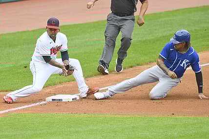 Sep 20, 2021; Cleveland, Ohio, USA; Kansas City Royals third baseman Adalberto Mondesi (27) steals third base beside Cleveland Indians third baseman Jose Ramirez (11) in the second inning at Progressive Field. Mandatory Credit: David Richard-USA TODAY Sports