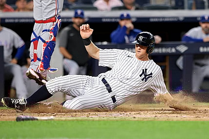 Sep 20, 2021; Bronx, New York, USA; New York Yankees second baseman DJ LeMahieu (26) scores on a RBI single by Aaron Judge (not pictured) against the Texas Rangers during the third inning at Yankee Stadium. Mandatory Credit: Vincent Carchietta-USA TODAY Sports