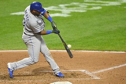 Sep 20, 2021; Cleveland, Ohio, USA; Kansas City Royals third baseman Hanser Alberto (49) doubles against the Cleveland Indians in the fourth inning at Progressive Field. Mandatory Credit: David Richard-USA TODAY Sports