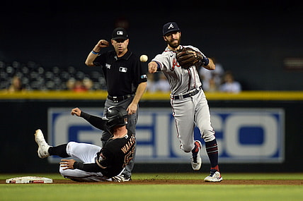Sep 22, 2021; Phoenix, Arizona, USA; Atlanta Braves shortstop Dansby Swanson (7) throws to first base after forcing Arizona Diamondbacks first baseman Christian Walker (53) at second base during the second inning at Chase Field. Mandatory Credit: Joe Camporeale-USA TODAY Sports