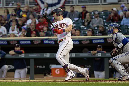 Sep 23, 2021; Minneapolis, Minnesota, USA; Minnesota Twins catcher Mitch Garver (8) hits a single during the first inning against the Toronto Blue Jays at Target Field. Mandatory Credit: Jordan Johnson-USA TODAY Sports