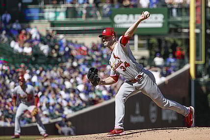 Sep 24, 2021; Chicago, Illinois, USA; St. Louis Cardinals starting pitcher J.A. Happ (34) delivers against the Chicago Cubs during the second inning of a Game 1 of the doubleheader at Wrigley Field. Mandatory Credit: Kamil Krzaczynski-USA TODAY Sports