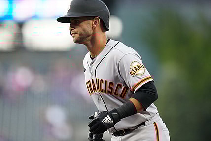 Sep 24, 2021; Denver, Colorado, USA; San Francisco Giants second baseman Tommy La Stella (18) scores a run in the first inning against the Colorado Rockies at Coors Field. Mandatory Credit: Ron Chenoy-USA TODAY Sports