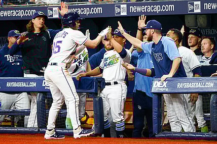 Sep 25, 2021; St. Petersburg, Florida, USA;  Tampa Bay Rays right fielder Brett Phillips (35)  is congratulated after hitting a sacrifice rbi in the eighth inning against the Miami Marlins at Tropicana Field. Mandatory Credit: Nathan Ray Seebeck-USA TODAY Sports