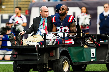 Sep 26, 2021; Foxborough, Massachusetts, USA;  New England Patriots running back James White (28) is carried off the field after a running play against New Orleans Saints during the first half at Gillette Stadium. Mandatory Credit: Stephen Lew-USA TODAY Sports