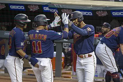 Sep 29, 2021; Minneapolis, Minnesota, USA; Minnesota Twins designated hitter Jorge Polanco (11) celebrates with center fielder Byron Buxton (25) after hitting a three run home run in the first inning against the Detroit Tigers at Target Field. Mandatory Credit: Jesse Johnson-USA TODAY Sports