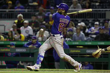 Sep 30, 2021; Pittsburgh, Pennsylvania, USA; Chicago Cubs right fielder Nick Martini (62) singles against the Pittsburgh Pirates during the fifth inning at PNC Park. Mandatory Credit: Charles LeClaire-USA TODAY Sports