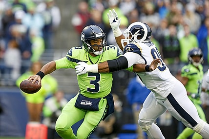 Oct 3, 2019; Seattle, WA, USA; Los Angeles Rams defensive tackle Aaron Donald (99) pressures Seattle Seahawks quarterback Russell Wilson (3) during the first quarter at CenturyLink Field. Mandatory Credit: Joe Nicholson-USA TODAY Sports