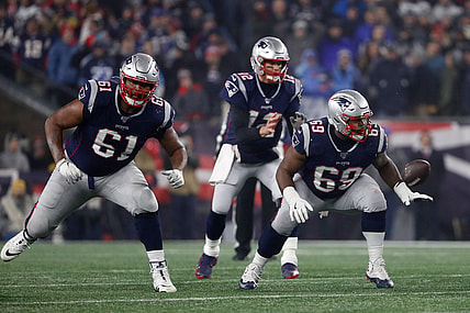 Jan 4, 2020; Foxborough, Massachusetts, USA; New England Patriots offensive tackle Marcus Cannon (61) and offensive guard Shaq Mason (69) prepare to block against the Tennessee Titans during a playoff game at Gillette Stadium. Mandatory Credit: Winslow Townson-USA TODAY Sports