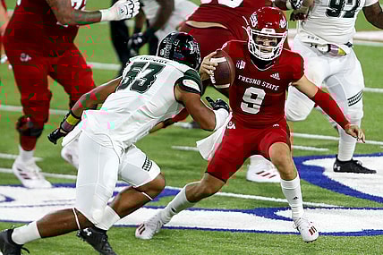 Oct 24, 2020; Fresno, California, USA; Fresno State Bulldogs quarterback Jake Haener (9) rushes the ball against Hawaii Rainbow Warriors linebacker Darius Muasau (53) during the third quarter at Bulldog Stadium. Mandatory Credit: Kiel Maddox-USA TODAY Sports