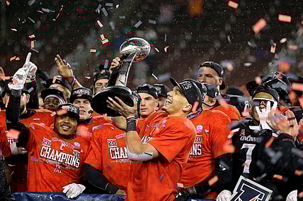 Cincinnati Bearcats quarterback Desmond Ridder (9) raises the championship trophy following the American Athletic Conference championship football game against the Tulsa Golden Hurricane, Saturday, Dec. 19, 2020, at Nippert Stadium in Cincinnati. The Cincinnati Bearcats won, 27-24.

Aac Championship Tulsa Golden Hurricane At Cincinnati Bearcats Football Dec 19